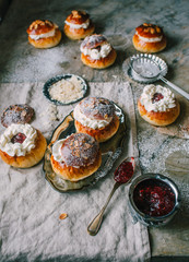 Homemade buns with jam and cream