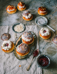 Homemade buns with jam and cream