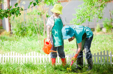 children gardening and watering