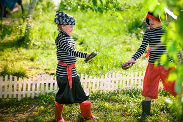 children play pirates at backyard