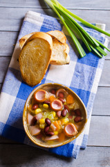 Soup with vegetables and sausages