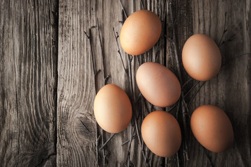 Chicken eggs on a wooden table