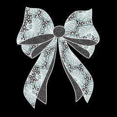White lacy bow on black background