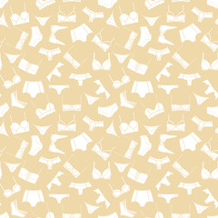 White lingerie on beige background seamless pattern