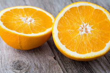 Orange slice on the grey  background.