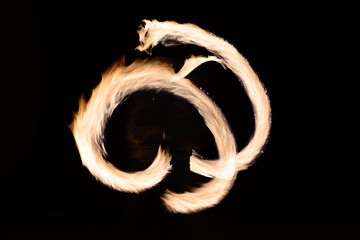 man sppining fire poi in Thailand