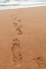 Footprints on the sand.