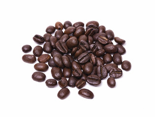 Small pile of roasted coffee beans isolated on white background