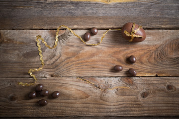 Chocolate Easter Eggs Over Wooden Background