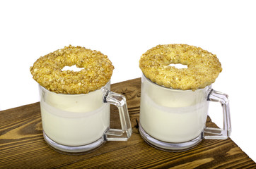 Two glasses of milk and cookies.