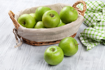 Green apples in basket