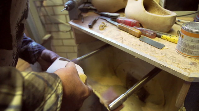 Sanding the inside of a Clog [Slomo]