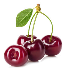 Juicy cherry with leaf close-up on a white background.