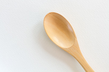 Wooden spoon on White paper background