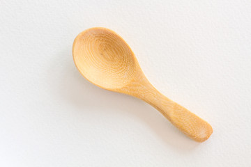 Wooden spoon on White paper background