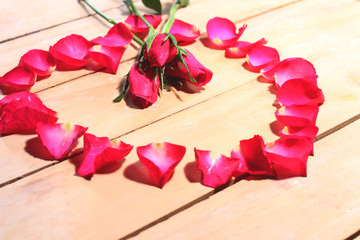 Petals of roses on the table.