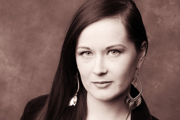 Obraz premium Copper toned Shot of a Confident Young Woman . Plain Wall with