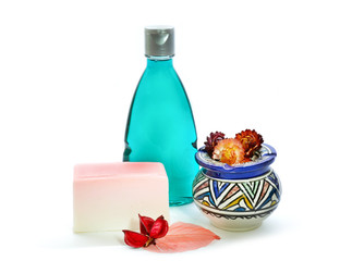 Handmade soap, blue colored shower gel bottle and vase.Isolated on white background