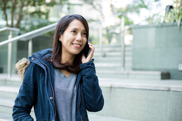 Woman talk to cellphone at outdoor