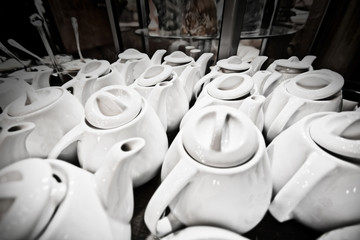 A lot of tea pots in the cafeteria.