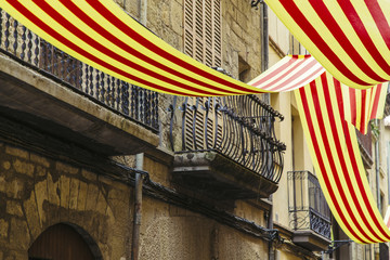 Catalan flags decoration a town in a party - obrazy, fototapety, plakaty