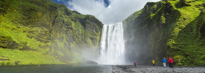 panorama with people and waterfall in Iceland