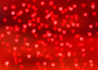 Abstract red background with red heart shaped bokeh lights
