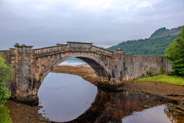 Fototapeta na wymiar Disused bridge at the head of Loch Shira Loch Fyne