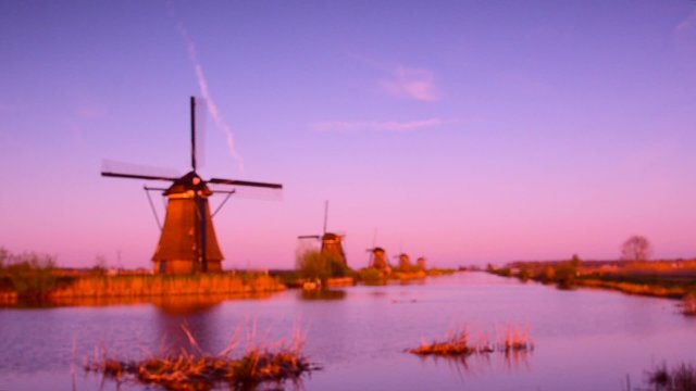 The picturesque landscape with aerial mills on the channel in Kinderdiyk, Netherlands at sunset. Full HD video. (relaxation, meditation, stress reduction - concept)