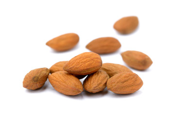Group unpeeled almonds isolated on white background