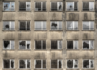 facade with broken windows of a historical abandoned building from nazi era in Germany, Prora, Rugia Island, HDR image