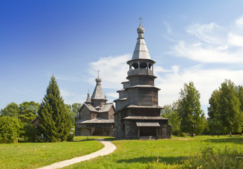 Fototapeta na wymiar Ancient wooden church on a forest glade. Russia...