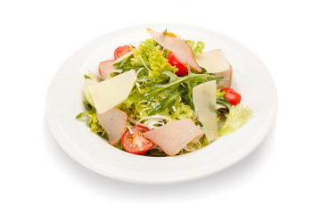 Vegetable salad with ham, parmesan cheese and cherry tomatoes.
