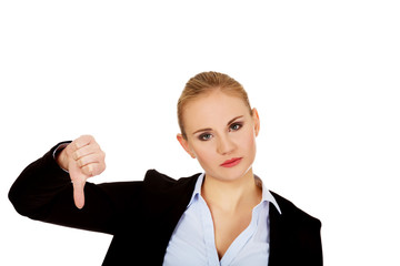 Unhappy businesswoman with thumbs down gesture © Piotr Marcinski