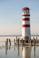 Lighthouse at the end of the wooden pier. Podersdorf am see, Austria