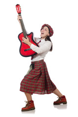 Woman in scottish clothing with guitar