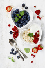 Healthy breakfast of muesli, berries with yogurt and seeds