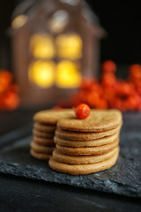 Heart shaped biscuits with ash berries on a table