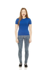 Frustrated young woman screaming.