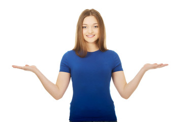 Smiling woman showing something on palms.