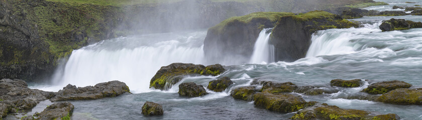 strong river with waterfall and stones in Iceland
