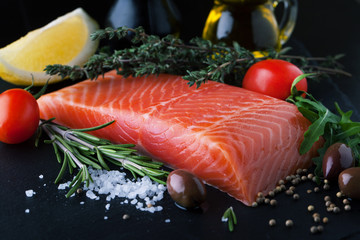 Fresh salmon with spices, herbs, rosemary and lemon