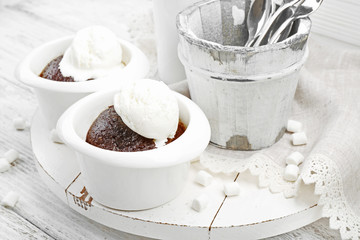 Served table of chocolate lava cake with ice-cream