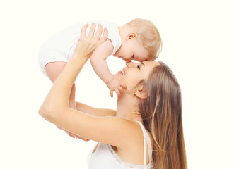 Happy smiling mother with baby having fun together on white back
