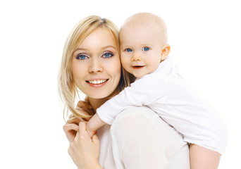 Portrait happy smiling mother and baby having fun together on a