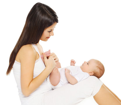 Happy young loving mother holding baby on a white background