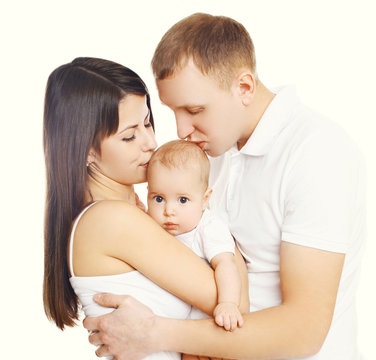Mother and father kissing baby, happy family on a white backgrou