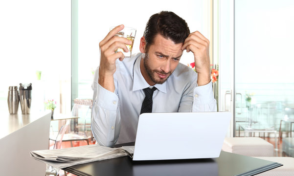 worried and tired businessman in crisis working on computer laptop