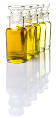 Avocado fruit oil, sesame seed oil, olive oil, grape seed oil and corn oil in vial glass bottle over white background