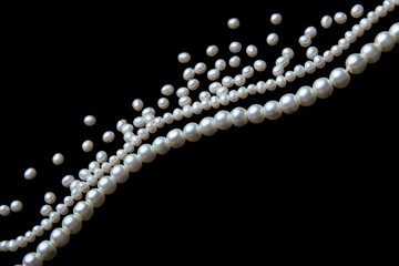 beautiful pearls on black background